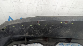 The front bumper lower absorber of Toyota Venza 21-24 is dented, worn, and has cracks.