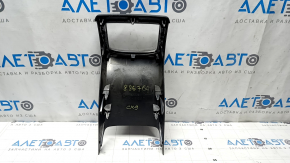 Mazda CX-9 rear center console trim, black, with chrome frame, scratches