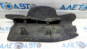 The lower control arm cover under the rear left spring is worn out for the Audi E-Tron 19-23.