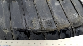 The lower control arm cover under the rear right spring is worn out for the Audi E-Tron 19-23.