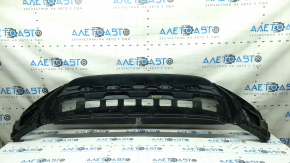 The front bumper lip of the VW Tiguan 18-21 is worn and dented.