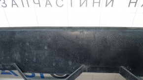 The front bumper lip of the VW Tiguan 18-21 is worn and dented.