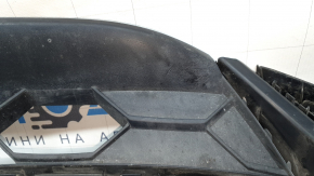 The front bumper lip of the VW Tiguan 18-21 is worn and dented.