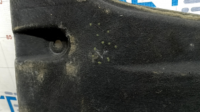 The left underbody protection of the Audi A5 F5 18-18 5D is pressed and worn.