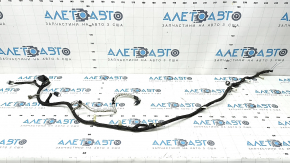 The wiring for the rear bumper of a Ford Escape MK4 20 for parking sensors and a foot-operated trunk opening sensor has been cut off.