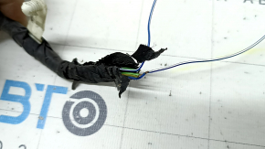 The wiring for the rear bumper of a Ford Escape MK4 20 for parking sensors and a foot-operated trunk opening sensor has been cut off.