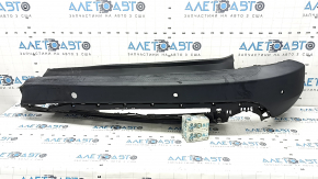 Bare rear bumper for Ford Escape MK4 20-26 with parking sensors and no towbar. Structure, scratches, and detached parking sensor ring.