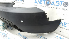 Bare rear bumper for Ford Escape MK4 20-26 with parking sensors and no towbar. Structure, scratches, and detached parking sensor ring.