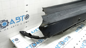 Bare rear bumper for Ford Escape MK4 20-26 with parking sensors and no towbar. Structure, scratches, and detached parking sensor ring.