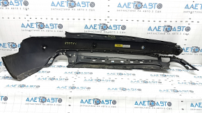 Bare rear bumper for Ford Escape MK4 20-26 with parking sensors and no towbar. Structure, scratches, and detached parking sensor ring.