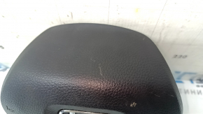The Honda Accord 18-22 driver's steering wheel airbag is black and scratched.