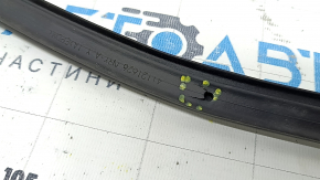 Mazda CX-90 24-26 rear hood seal on the grille, fasteners are torn