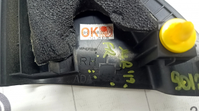 The inner right mirror cover for a Hyundai Elantra AD 17-20 is black, worn, and the mount is broken.