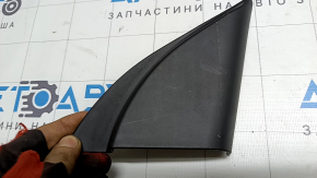The inner right mirror cover for a Hyundai Elantra AD 17-20 is black, worn, and the mount is broken.