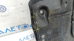 The front engine guard for a Mazda CX-90 24-26 is dented, cracked, and missing a fragment.