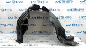 The front right fender liner of a Mazda CX-90 24-26 is dented.