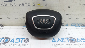 The steering wheel airbag for the driver's side of the Audi Q5 8R 13-17 is black and scratched.