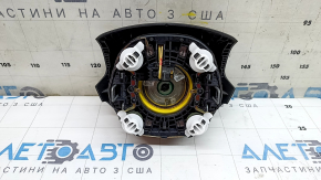 The steering wheel airbag for the driver's side of the Audi Q5 8R 13-17 is black and scratched.