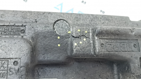 The front bumper absorber of the Porsche Macan 15-18 is dented, broken, missing a fragment