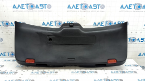 The lower trim of the tailgate of a Porsche Macan 15-18 is worn and cracked.