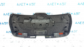 The lower trim of the tailgate of a Porsche Macan 15-18 is worn and cracked.