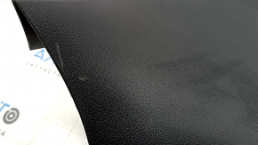The lower trim of the tailgate of a Porsche Macan 15-18 is worn and cracked.