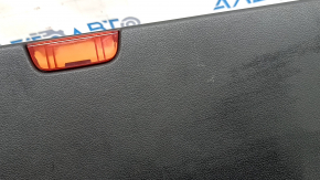 The lower trim of the tailgate of a Porsche Macan 15-18 is worn and cracked.