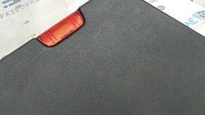 The lower trim of the tailgate of a Porsche Macan 15-18 is worn and cracked.