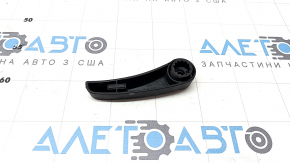 The hood release handle for the Porsche Macan 15-23 is located under the hood.