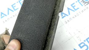 The front trunk floor of a Porsche Macan 15-26 is black and needs cleaning, it has come apart.