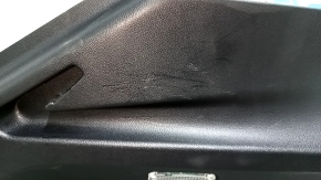 Left arch trim for a 19-23 Porsche Cayenne, black, with a cigarette lighter, scratches
