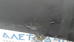 The front bumper lip of a Porsche Macan 15-18 is cracked, dented, has scratches, and has cracks in the fasteners. After repair