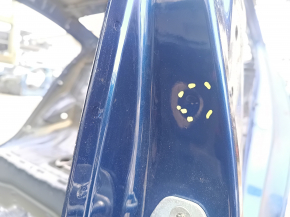The central left body pillar of a Hyundai Elantra AD 17-20 is dented on the body.