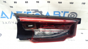 The left interior tailgate light for a Mazda CX-9 16-23 is scuffed.