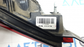 The left interior tailgate light for a Mazda CX-9 16-23 is scuffed.