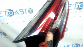 The left interior tailgate light for a Mazda CX-9 16-23 is scuffed.