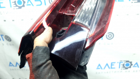 The left interior tailgate light for a Mazda CX-9 16-23 is scuffed.