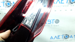 The left interior tailgate light for a Mazda CX-9 16-23 is scuffed.