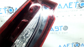 The left interior tailgate light for a Mazda CX-9 16-23 is scuffed.