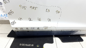The door is bare, front right, Mazda CX-9 16-23, white 25D, dented, bump