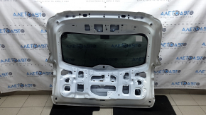 The trunk door is bare with glass for a Mazda CX-9 16-18, electric, white 25D, dented.