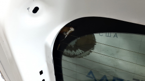 The trunk door is bare with glass for a Mazda CX-9 16-18, electric, white 25D, dented.