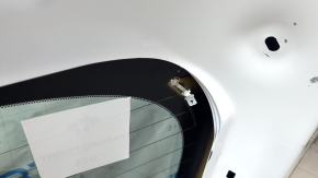 The trunk door is bare with glass for a Mazda CX-9 16-18, electric, white 25D, dented.