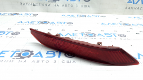 Right rear bumper reflector for Mazda CX-9 16-23 is cracked and worn.