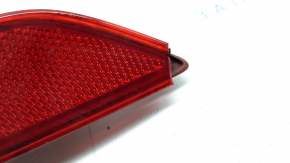Right rear bumper reflector for Mazda CX-9 16-23 is cracked and worn.