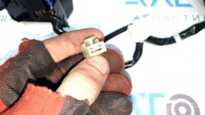 The steering wheel controls on a Mazda CX-9 (16-21) are worn.