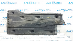 The left underbody protection of the Audi A3 8V 15-20 4d, 5d is torn and worn.