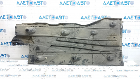 The left underbody protection of the Audi A3 8V 15-20 4d, 5d is torn and worn.