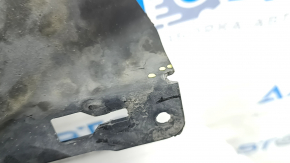 The left underbody protection of the Audi A3 8V 15-20 4d, 5d is torn and worn.