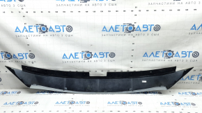 The upper grille cover of the Mazda CX-9 16-23 is dented, scratched, and worn.